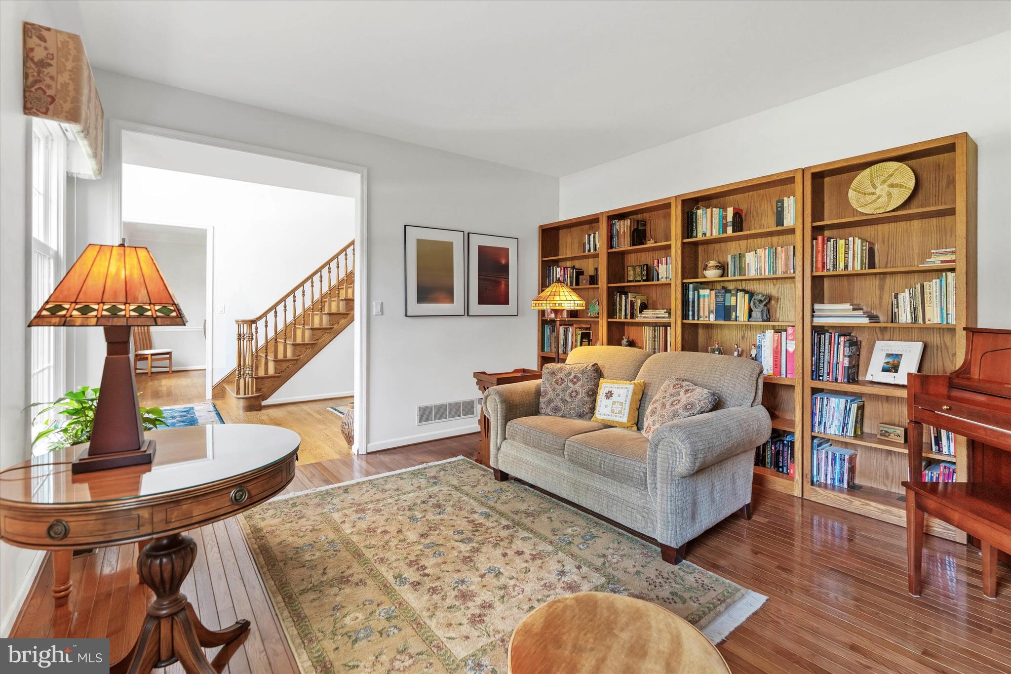 216 South Pond Road Hockessin, DE 19707 - Photo 5 of 61 a living room with furniture and a book shelf