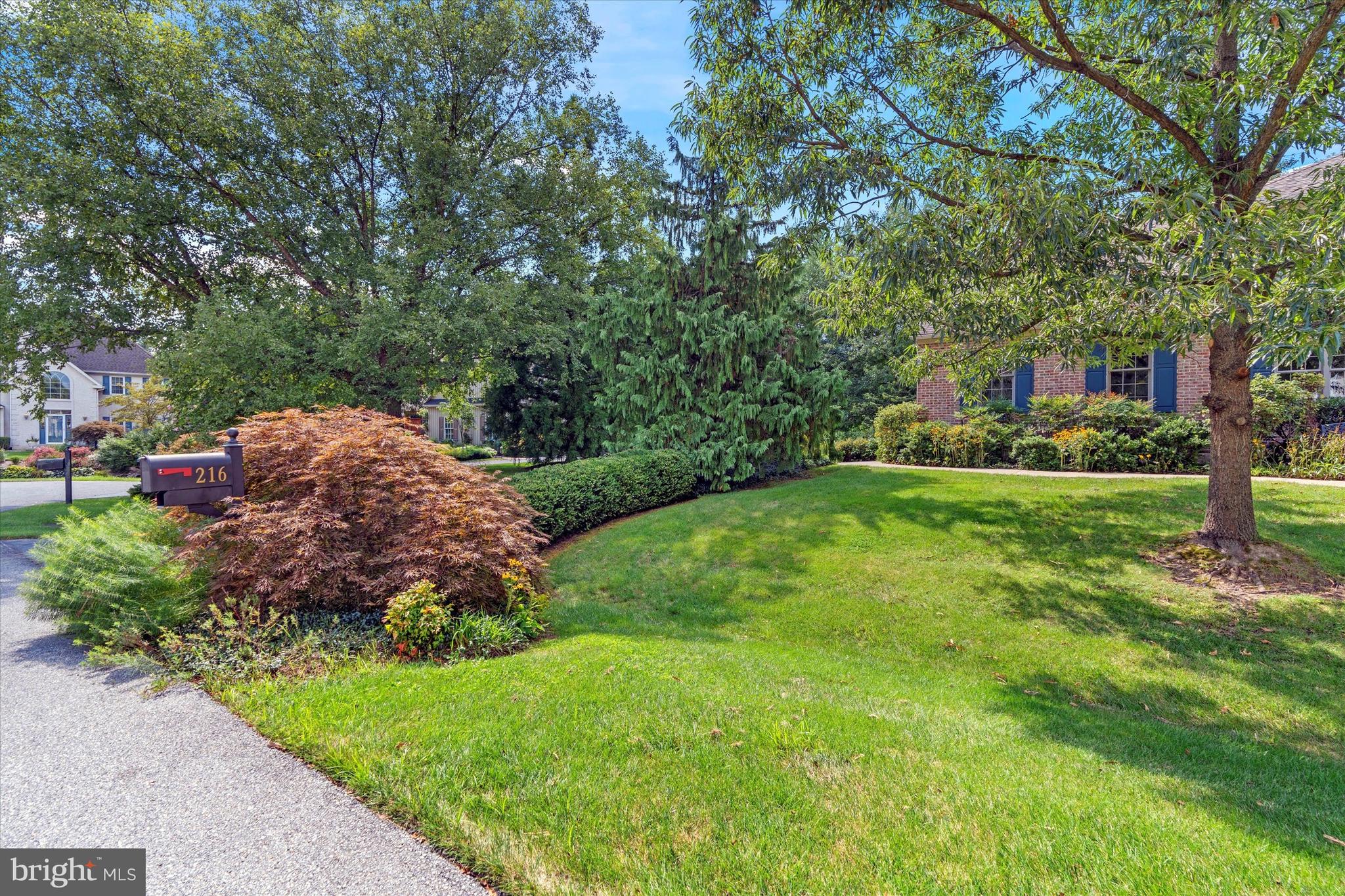 216 South Pond Road Hockessin, DE 19707 - Photo 55 of 61 a view of a house with a big yard and large trees