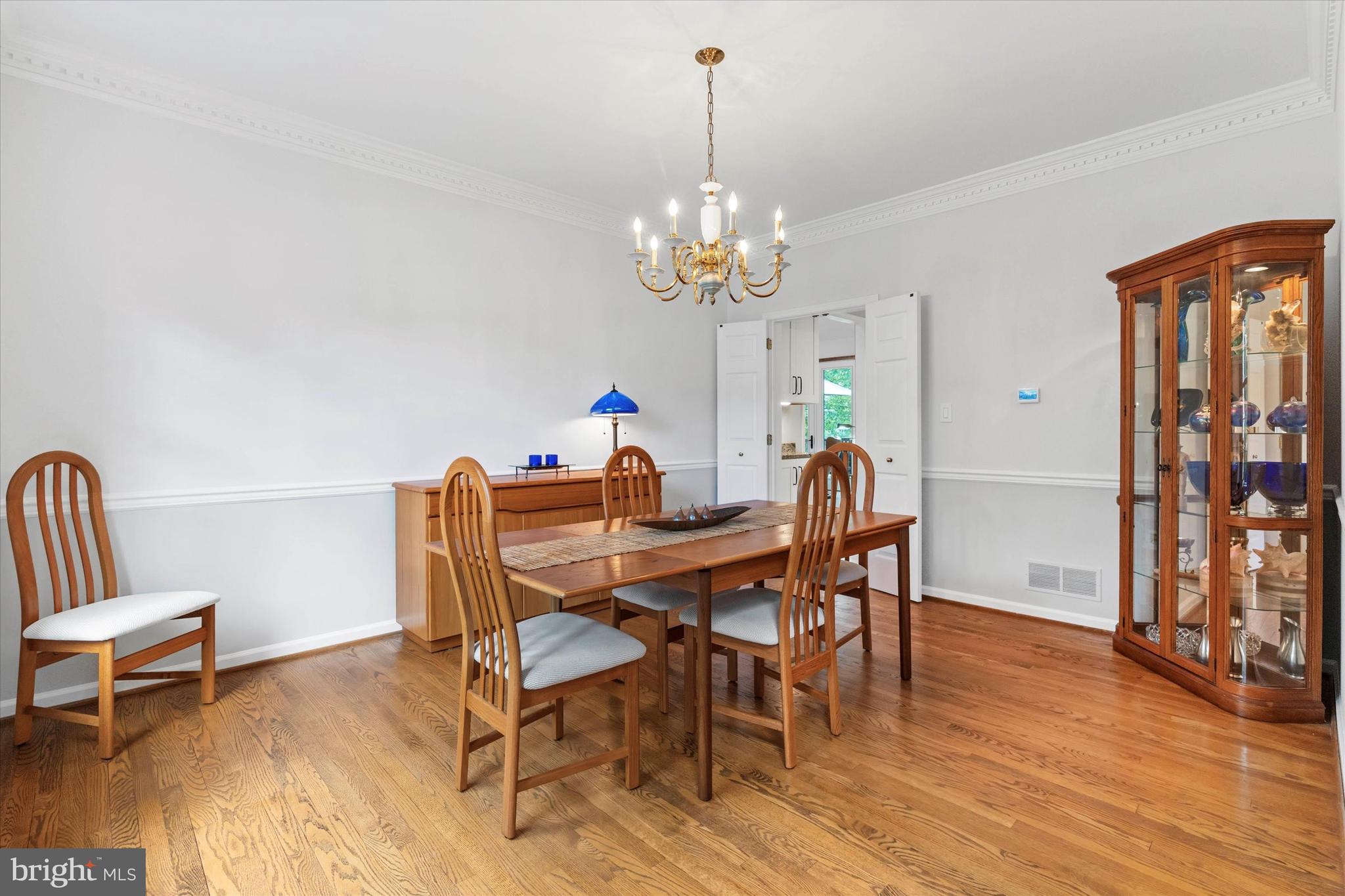 216 South Pond Road Hockessin, DE 19707 - Photo 8 of 61 a view of a dining room with furniture wooden floor and chandelier