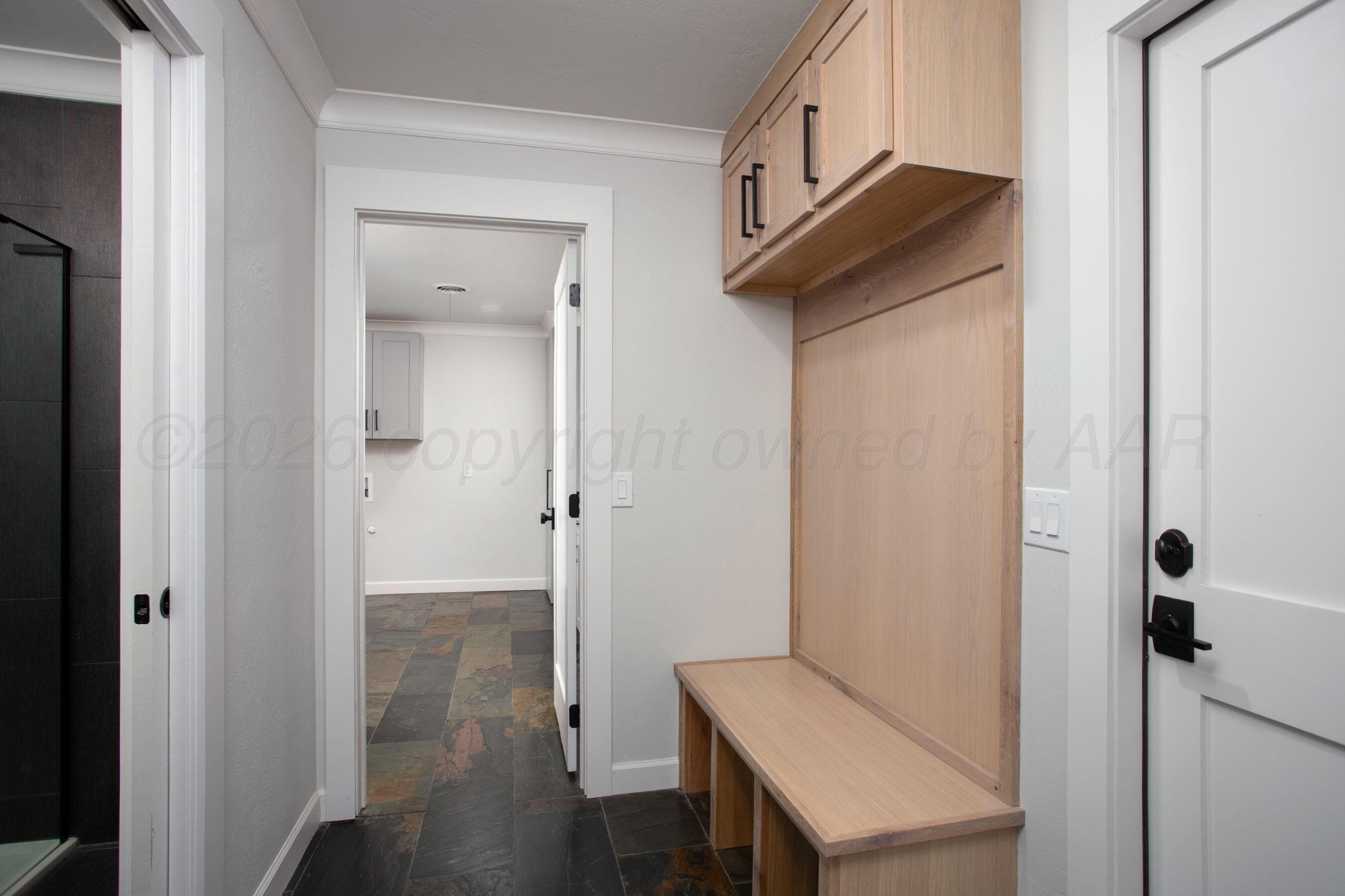 4217 West Farmers Avenue Amarillo, TX 79110 - Photo 14 of 38 a view of a hallway with wooden floor and staircase