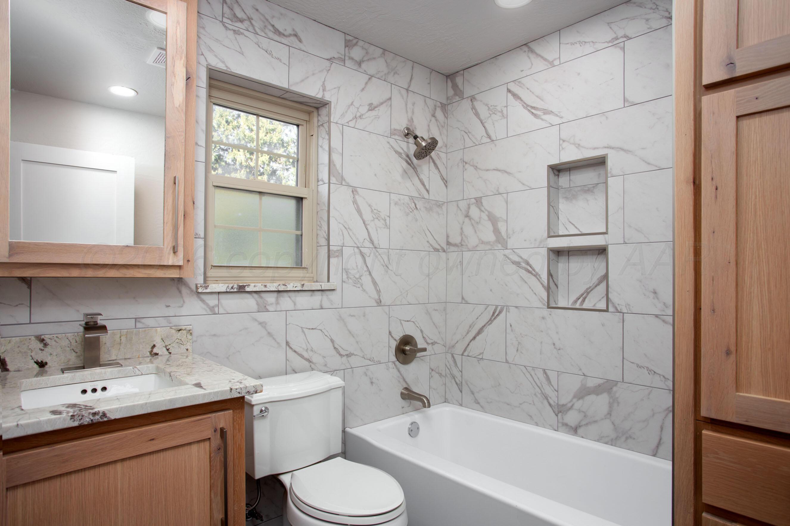 4217 West Farmers Avenue Amarillo, TX 79110 - Photo 24 of 38 a bathroom with a sink toilet and shower