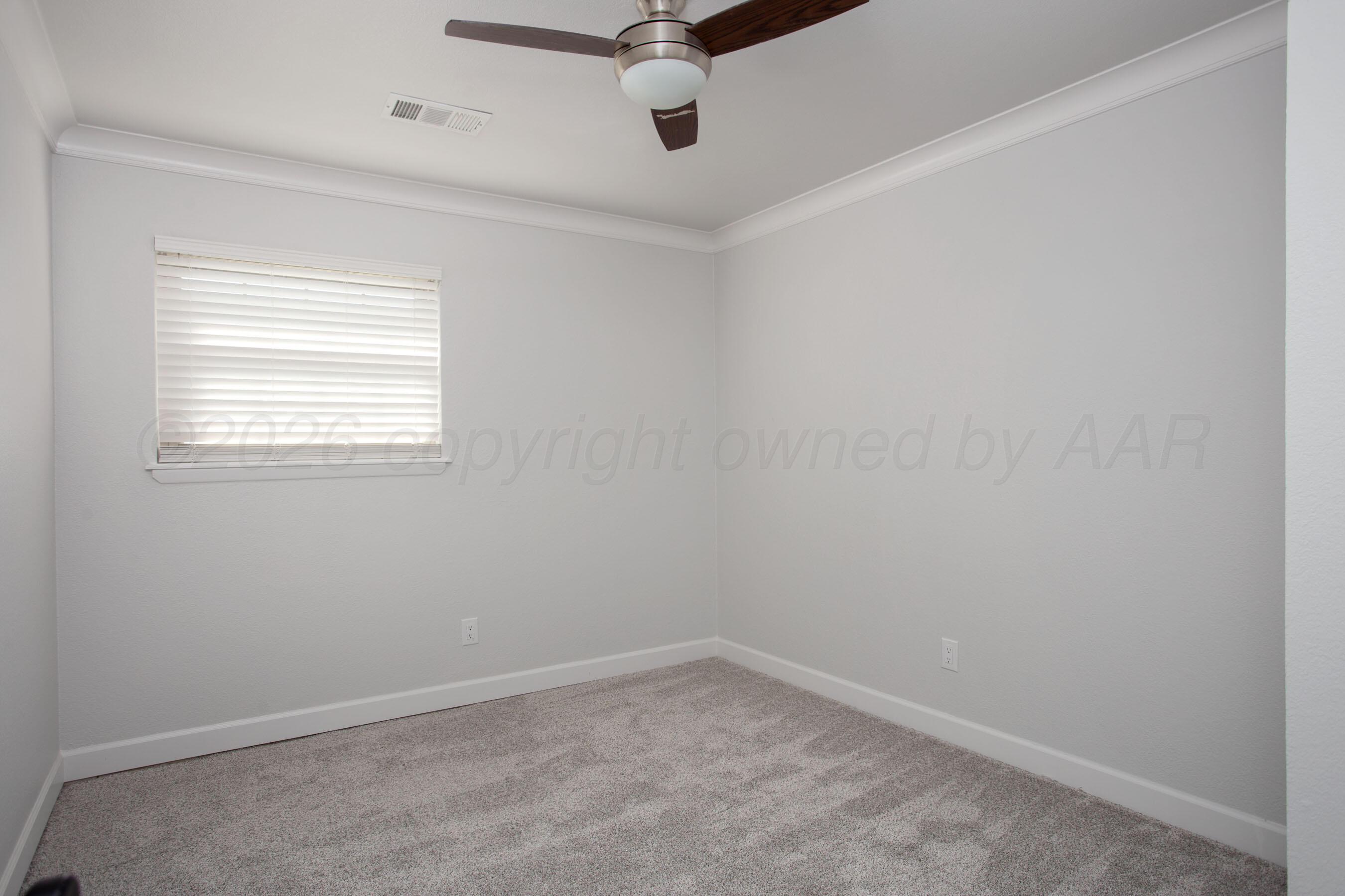 4217 West Farmers Avenue Amarillo, TX 79110 - Photo 28 of 38 an empty room with a window