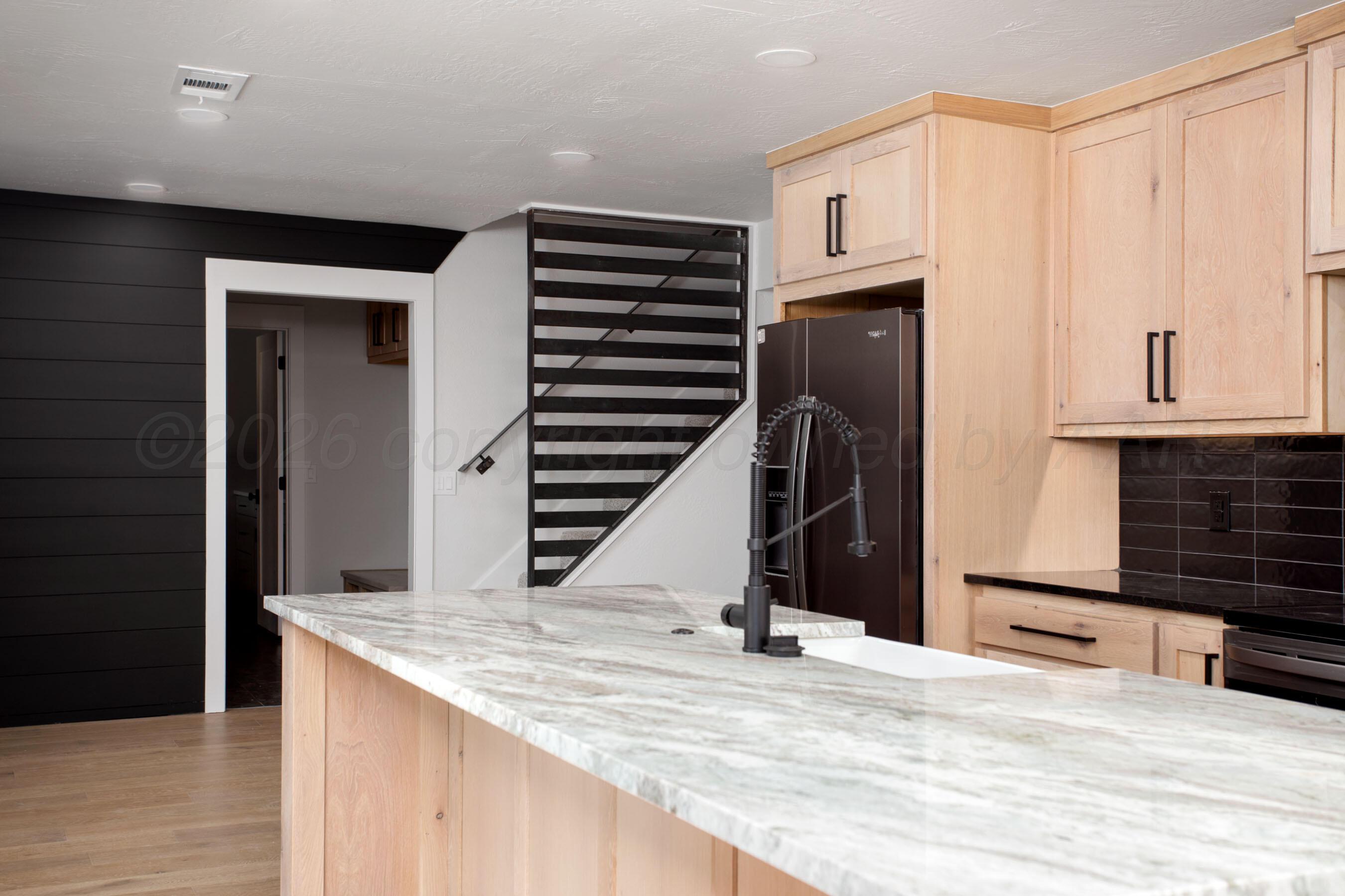 4217 West Farmers Avenue Amarillo, TX 79110 - Photo 3 of 38 a view of a kitchen from the hallway