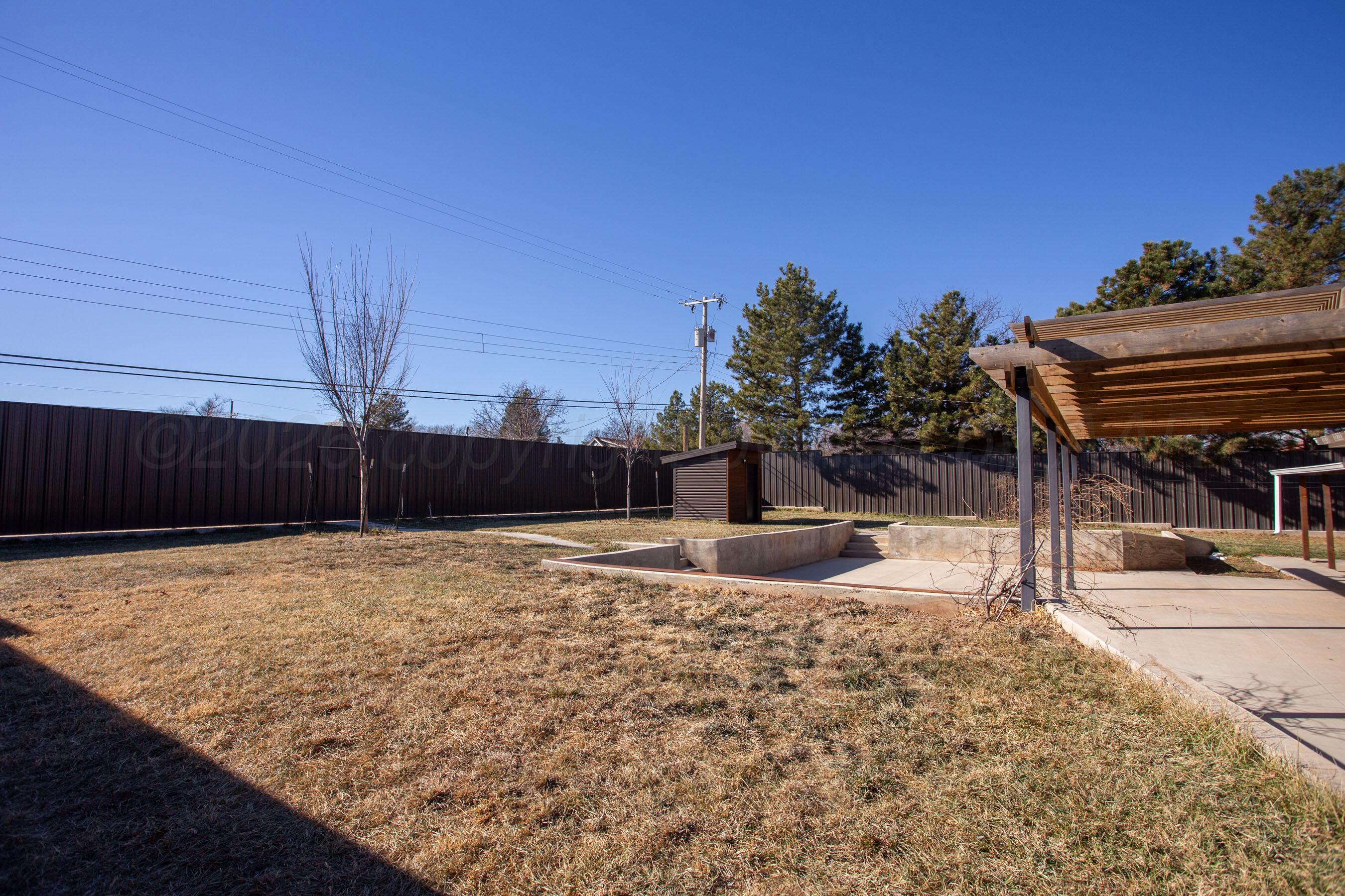 4217 West Farmers Avenue Amarillo, TX 79110 - Photo 33 of 38 a backyard of a house with wooden fence