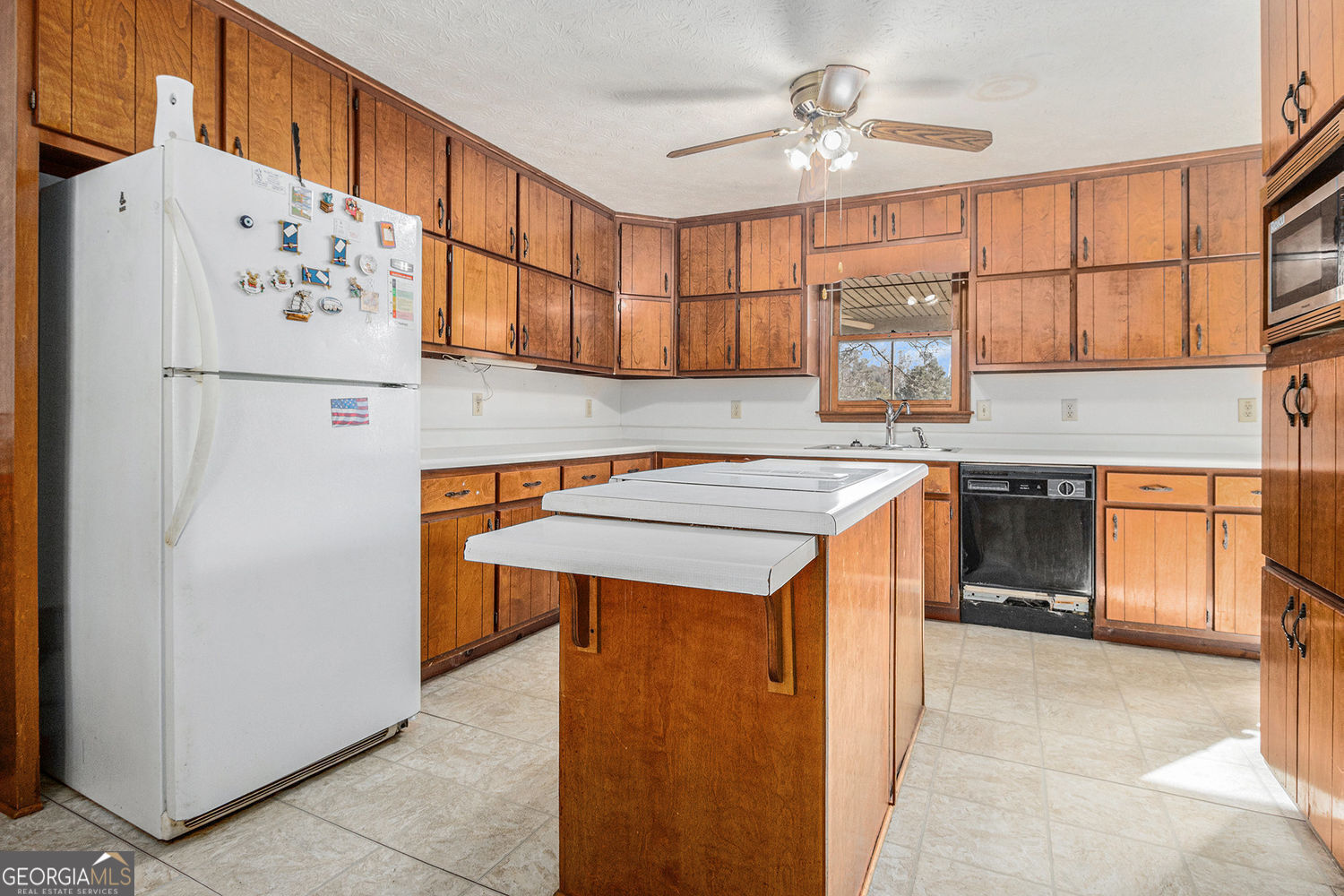 255 Barnett Road Hampton, GA 30228 - Photo 13 of 42 a kitchen with stainless steel appliances cabinets and a refrigerator