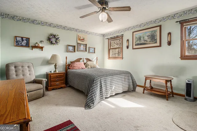 a bedroom with furniture and a window