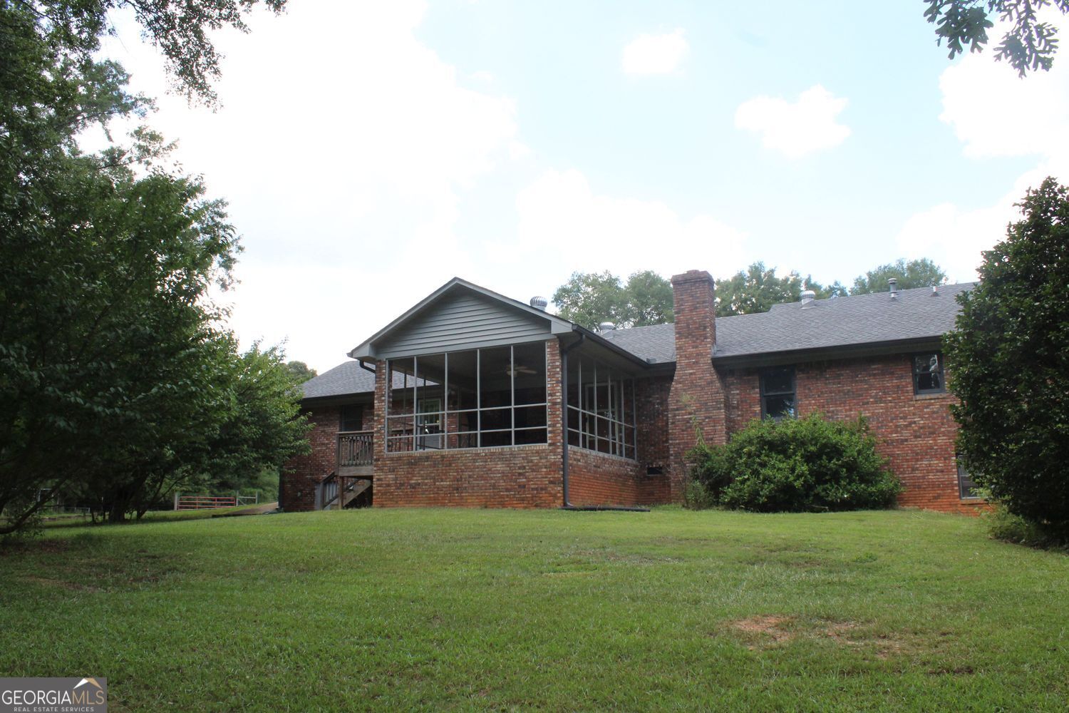 255 Barnett Road Hampton, GA 30228 - Photo 2 of 42 a front view of a house with a yard