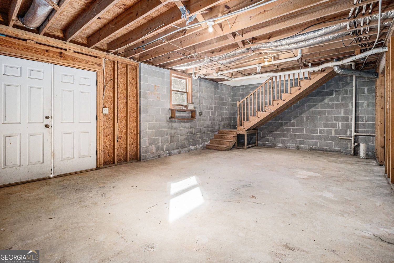 255 Barnett Road Hampton, GA 30228 - Photo 26 of 42 a view of an empty room with stairs