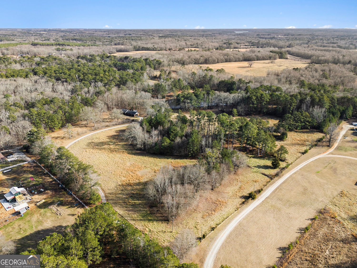 255 Barnett Road Hampton, GA 30228 - Photo 39 of 42 a view of a lake from a building
