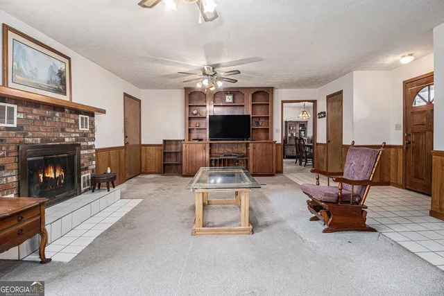 a living room with furniture and a fireplace