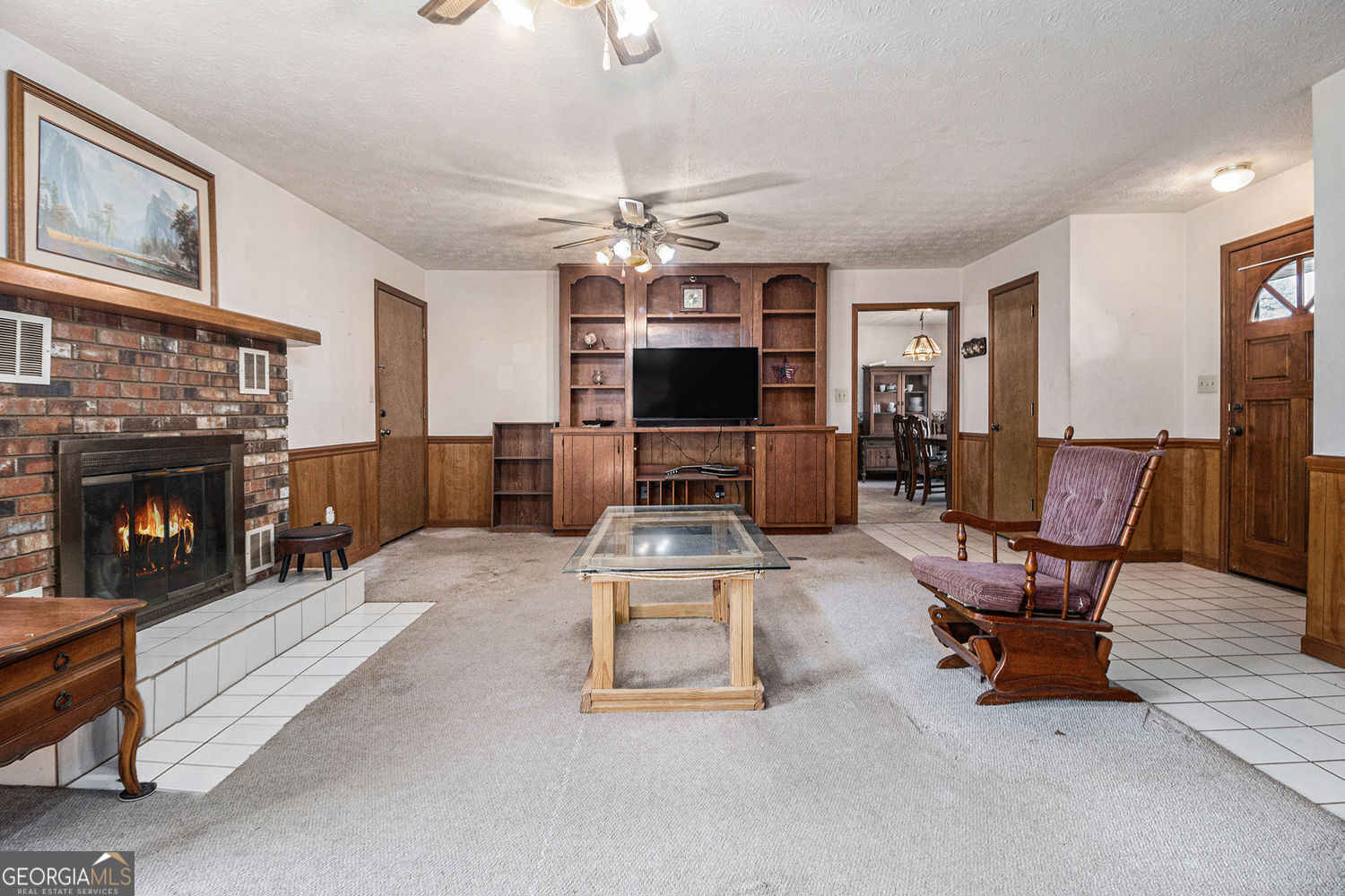 255 Barnett Road Hampton, GA 30228 - Photo 8 of 42 a living room with furniture and a fireplace