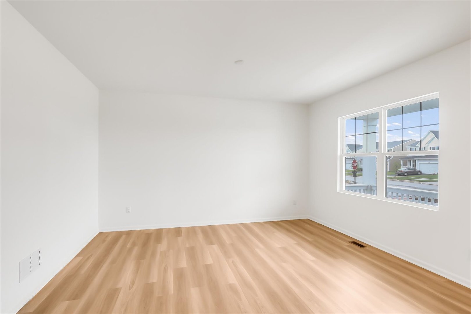 468 Endicott Road South Elgin, IL 60177 - Photo 3 of 32 a view of empty room with wooden floor and fan