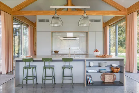 a kitchen with stainless steel appliances granite countertop a sink and cabinets