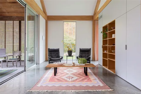 a living room with fireplace furniture and a flat screen tv