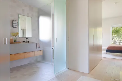 a bathroom with a double vanity sink and a mirror
