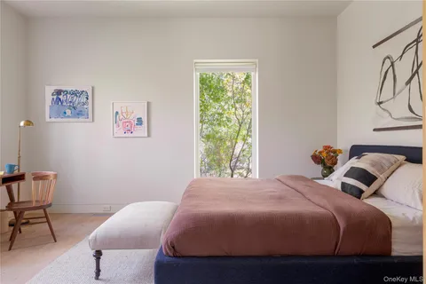 a bedroom with a bed and chair