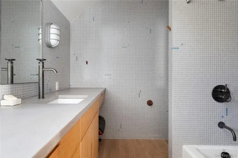a bathroom with a sink and a mirror