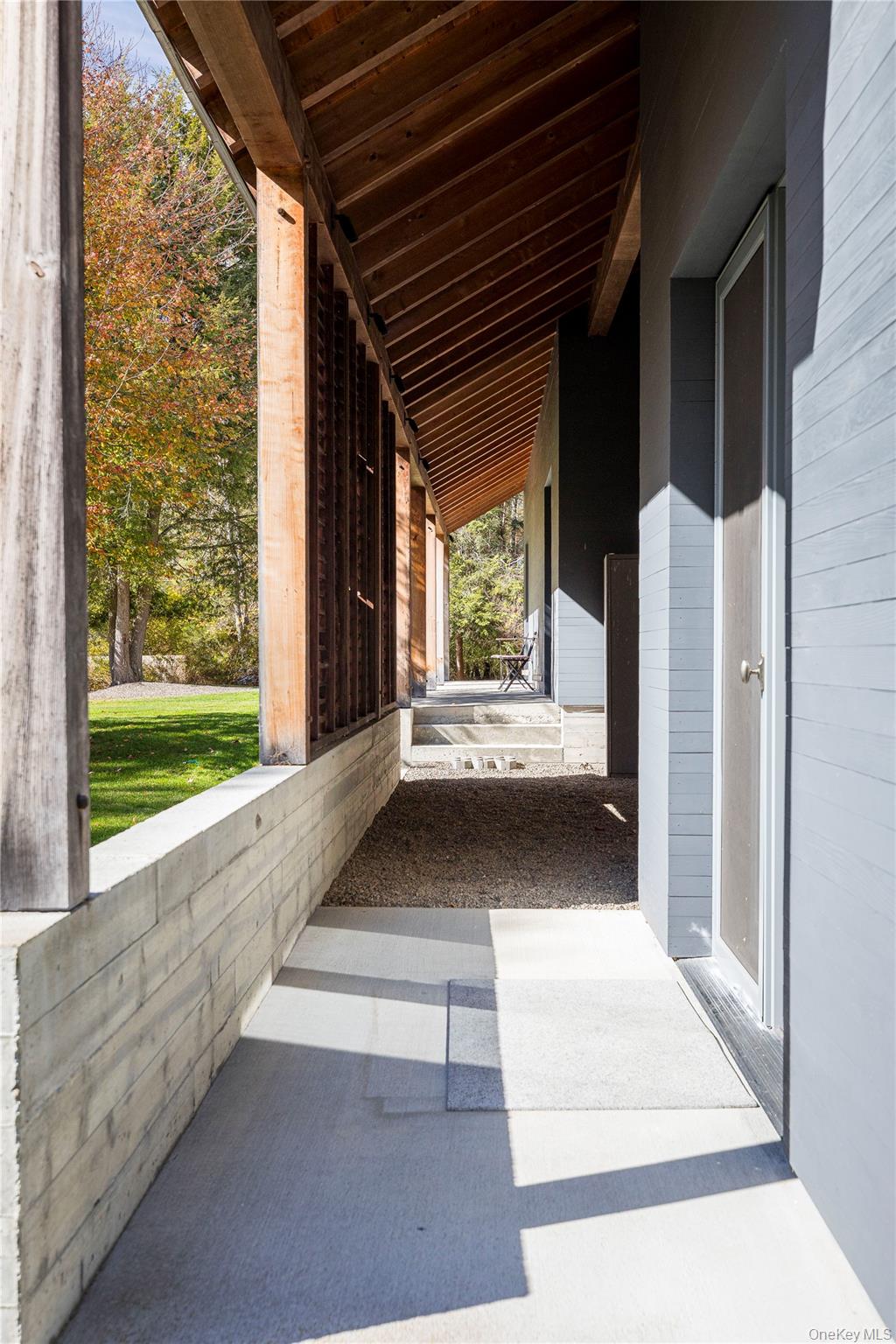 29 Drake Road Clinton Corners, NY 12514 - Photo 45 of 49 a view of a porch with wooden floor and a yard