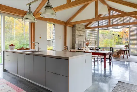 a very nice looking kitchen with a large window