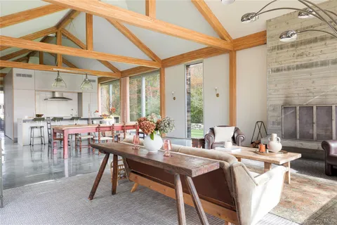 a view of a dining room with furniture window and outside view