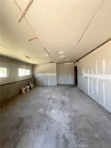 a view of empty room with windows