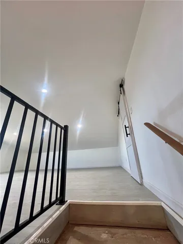 a view of an empty room with windows