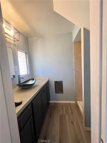 a view of a kitchen from a hallway