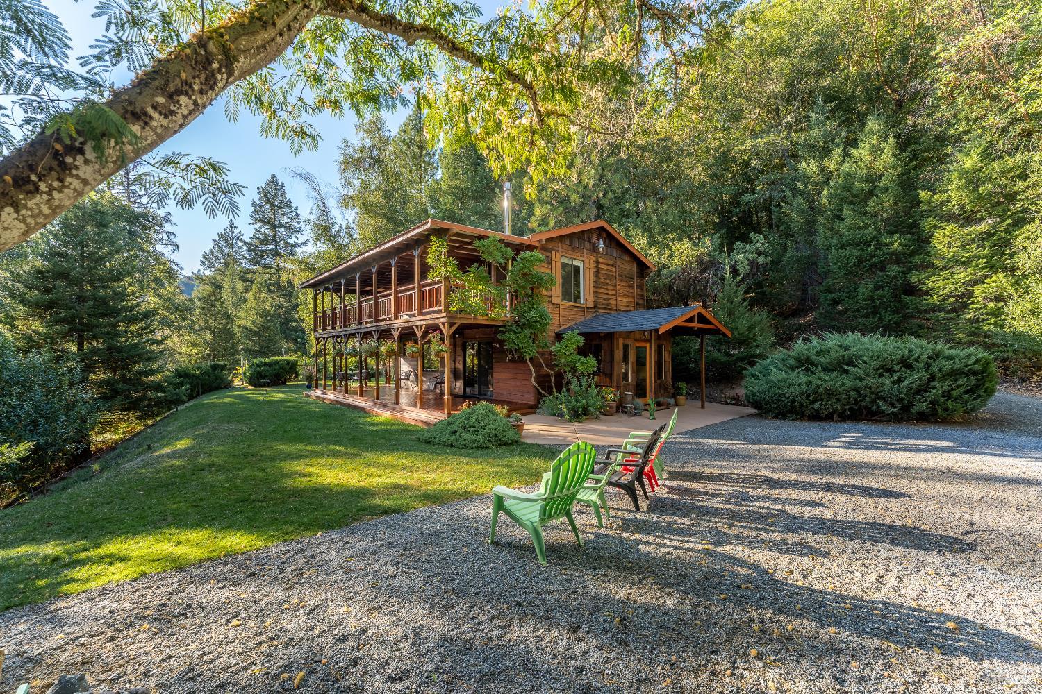 a front view of a house with a yard table and chairs