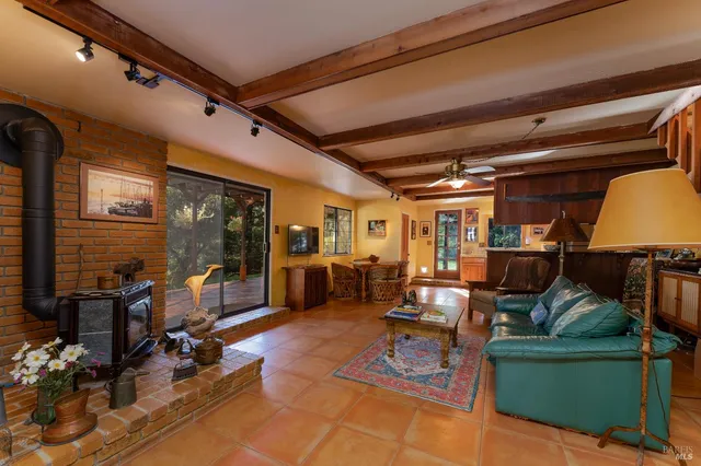 a living room with furniture and wooden floors