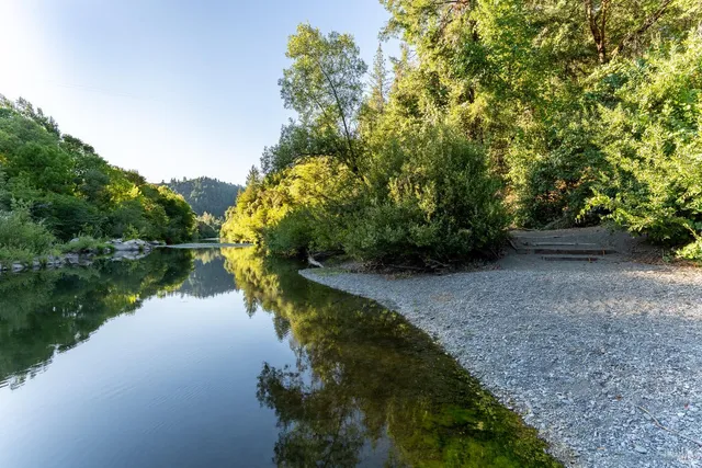 a view of a lake with a yard