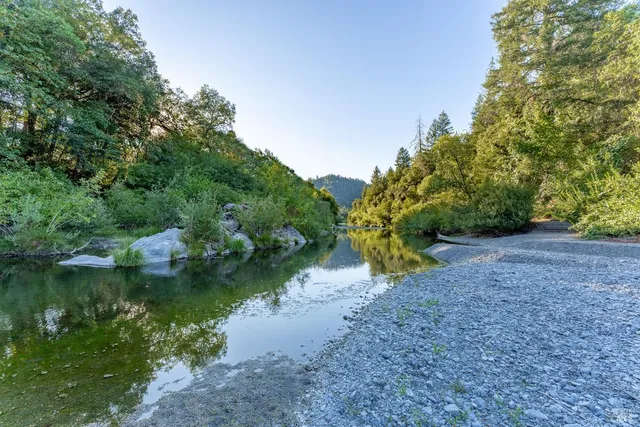 a view of porch with green trees in front