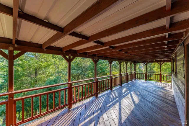 a view of porch with wooden floor