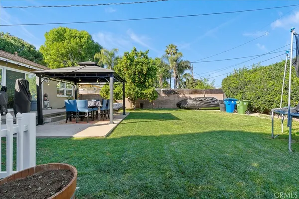 a view of a backyard with sitting area