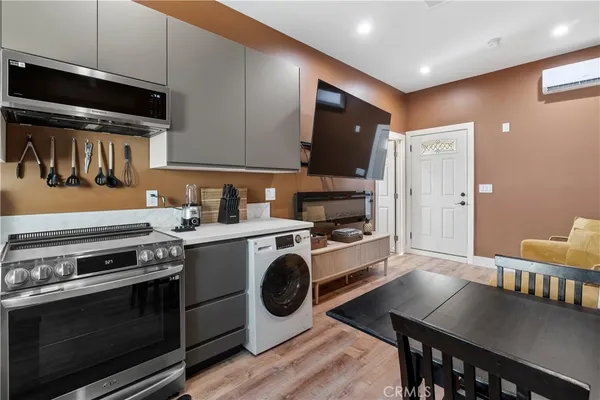 a kitchen with a stove and a refrigerator