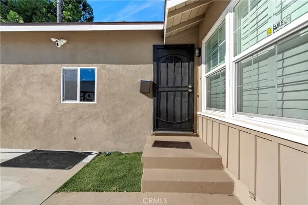 a view of house with backyard