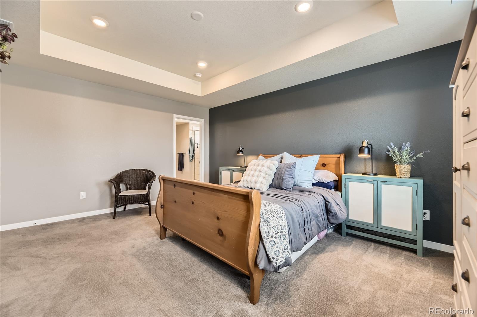 1182 Williams Loop Elizabeth, CO 80107 - Photo 16 of 42 a bed room with a bed and a chair