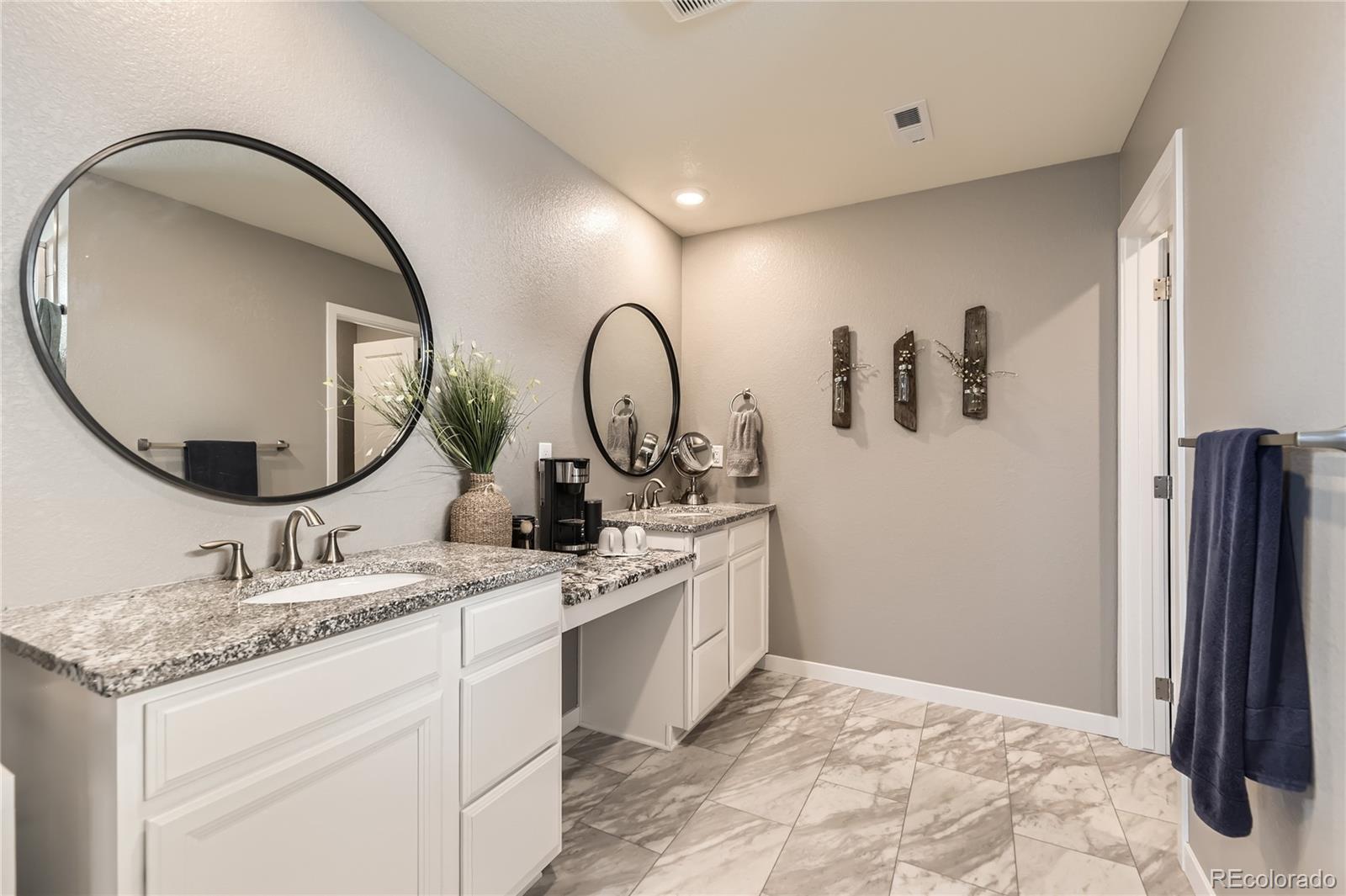1182 Williams Loop Elizabeth, CO 80107 - Photo 17 of 42 a bathroom with a sink and a mirror