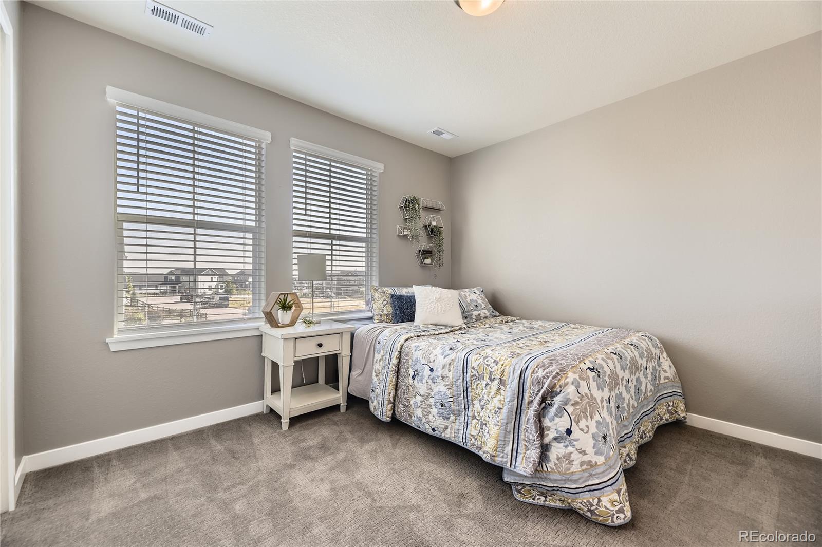 1182 Williams Loop Elizabeth, CO 80107 - Photo 20 of 42 a bedroom with a bed and window