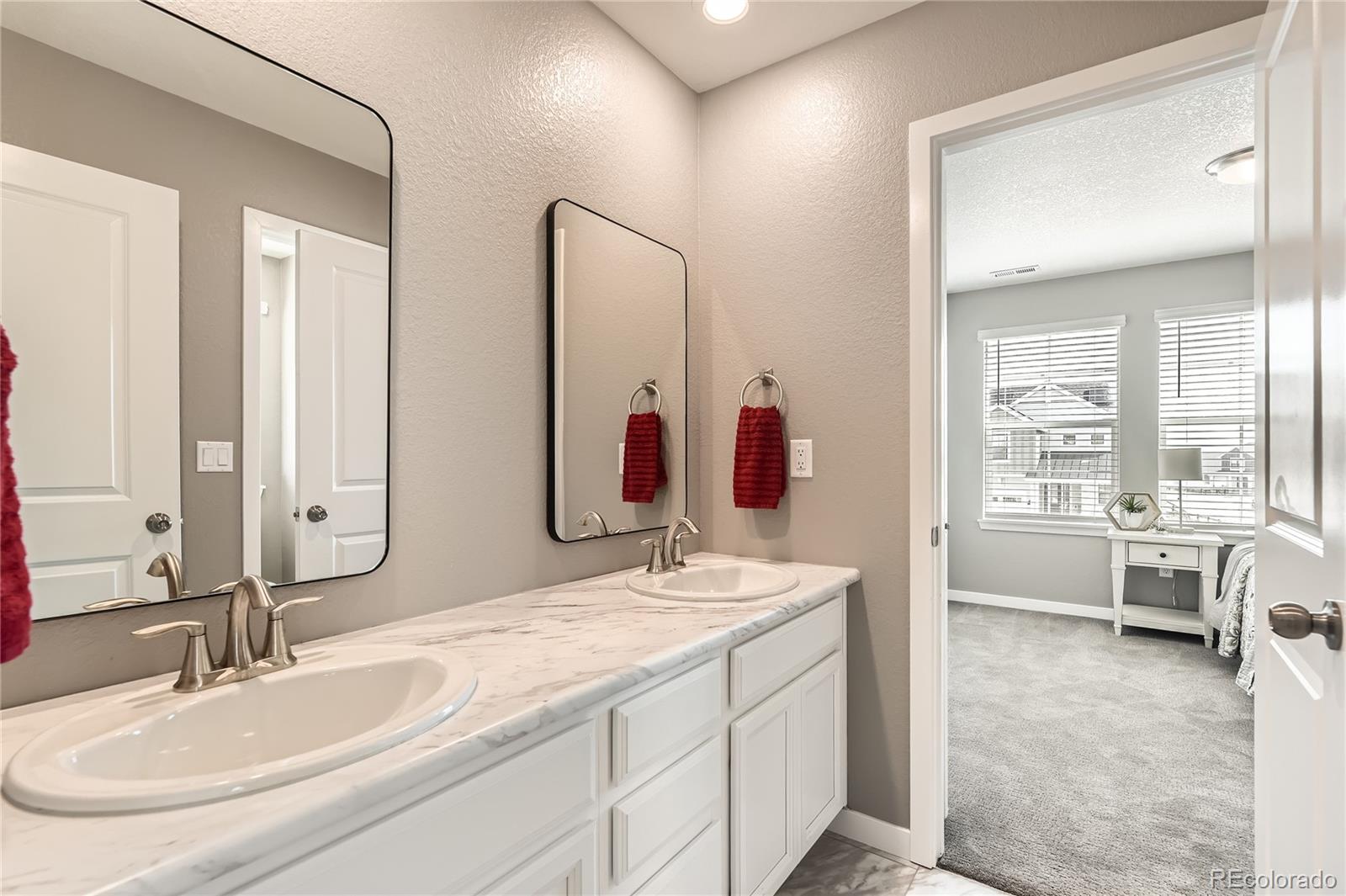 1182 Williams Loop Elizabeth, CO 80107 - Photo 21 of 42 a en suite bathroom with a granite countertop tub sink and mirror