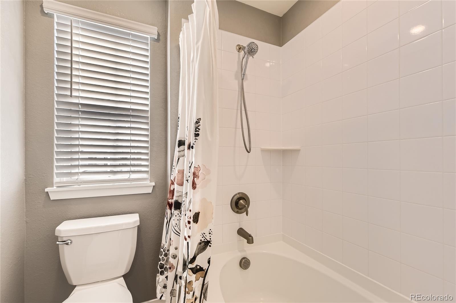 1182 Williams Loop Elizabeth, CO 80107 - Photo 22 of 42 a bathroom with a toilet and a shower