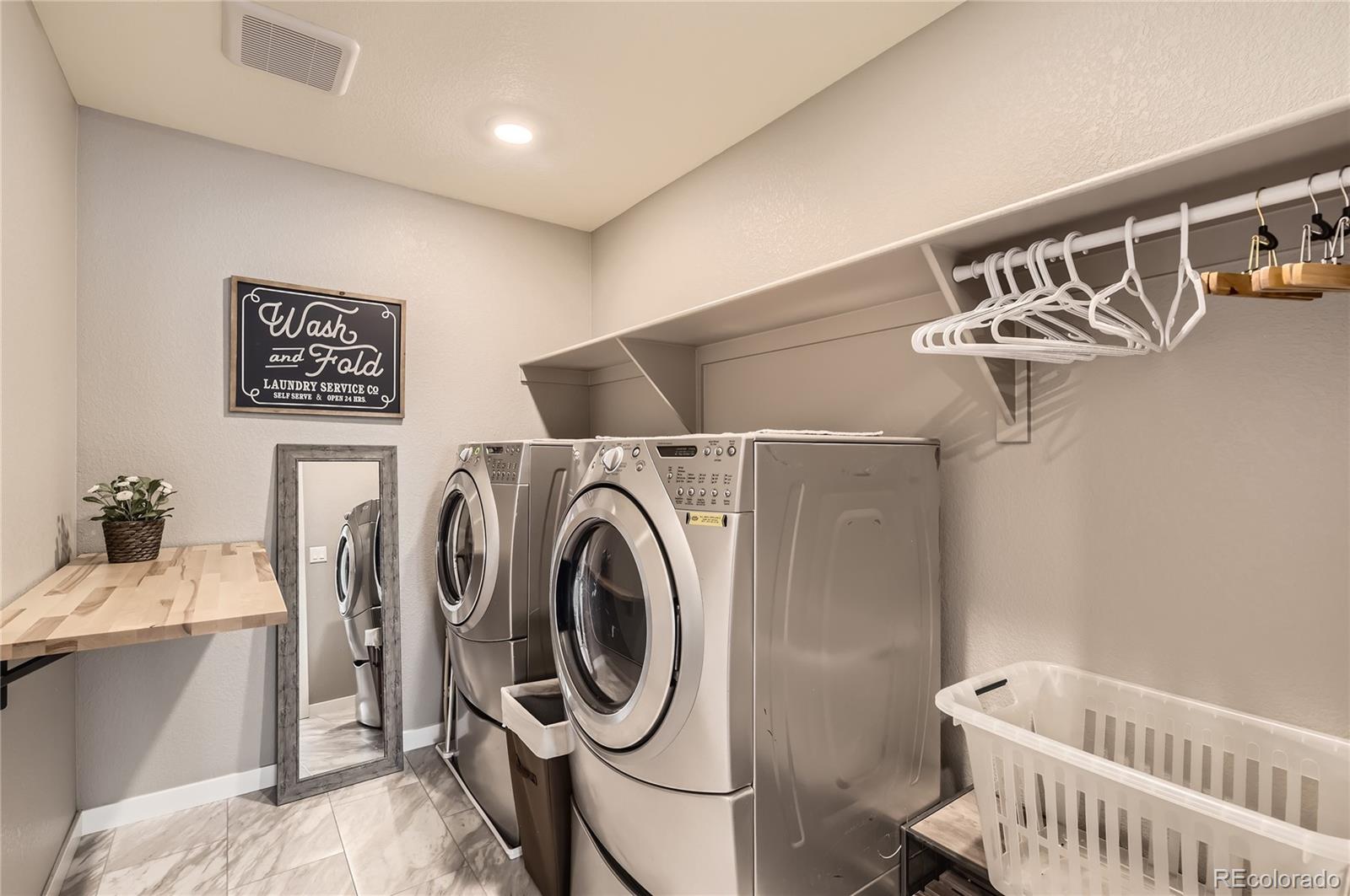 1182 Williams Loop Elizabeth, CO 80107 - Photo 23 of 42 a utility room with dryer and washer