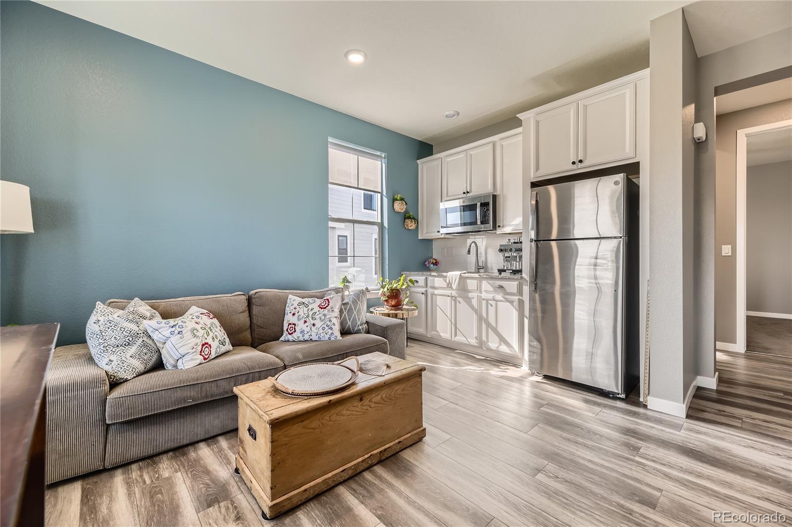 1182 Williams Loop Elizabeth, CO 80107 - Photo 28 of 42 a living room with furniture fireplace and wooden floor