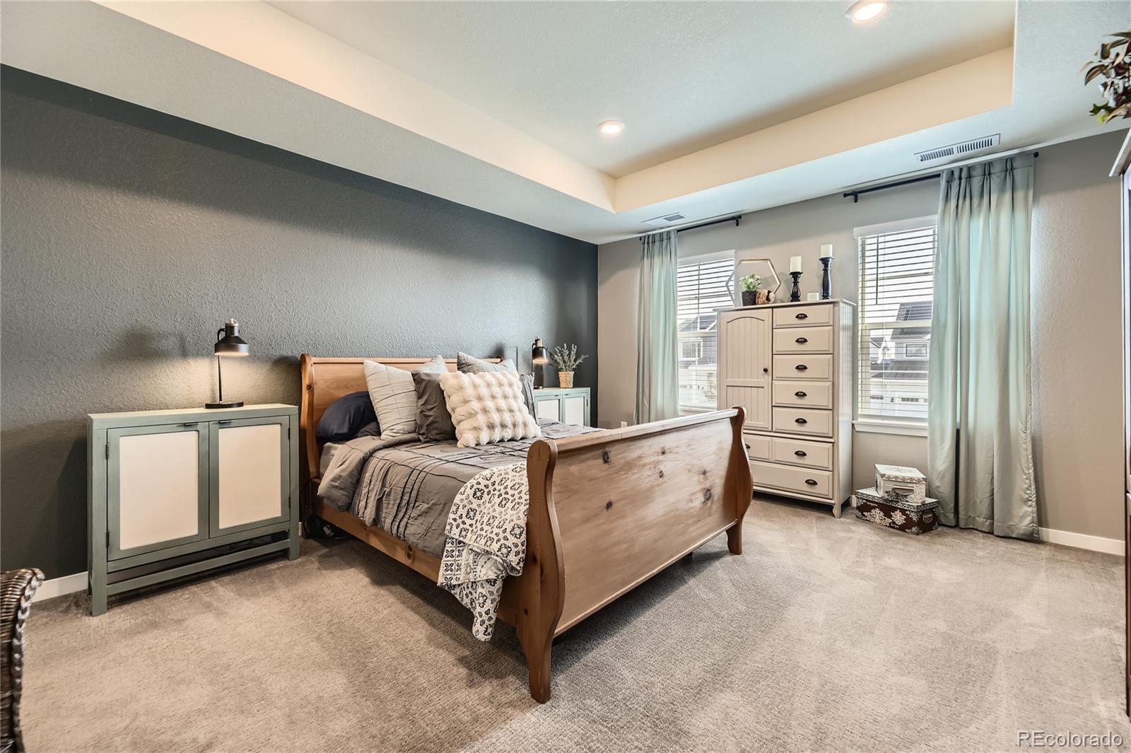 1182 Williams Loop Elizabeth, CO 80107 - Photo 3 of 42 a bed room with a bed and a chair