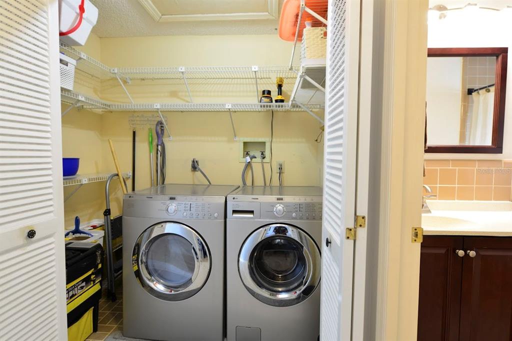 6715 Devonshire Lane, Unit 6715 New Port Richey, FL 34653 - Photo 19 of 38 GE stainless steal washer and dryer were purchased in 2016 and stay with the home.