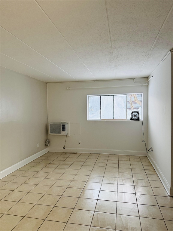126 Beaver Street, Unit 5 Framingham, MA 01702 - Photo 11 of 11 a view of an empty room and window