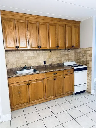 a kitchen with stainless steel appliances granite countertop a sink and cabinets
