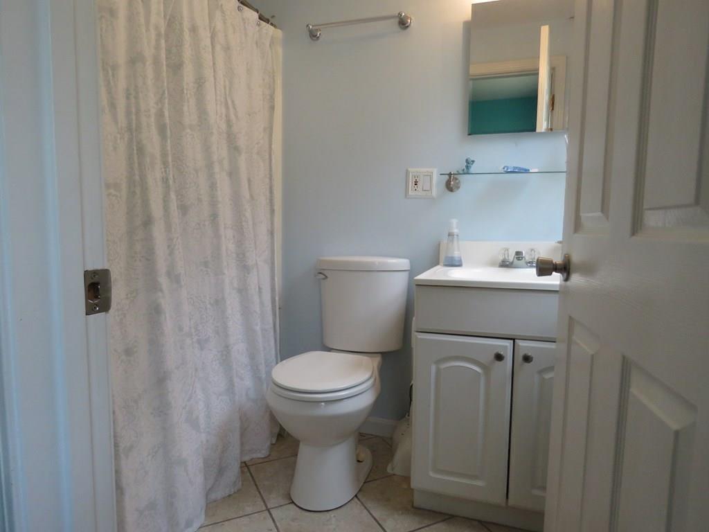 17 Rockland House Road Hull, MA 02045 - Photo 23 of 26 a bathroom with a sink toilet and a mirror