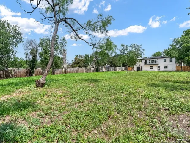 a view of a house with a big yard