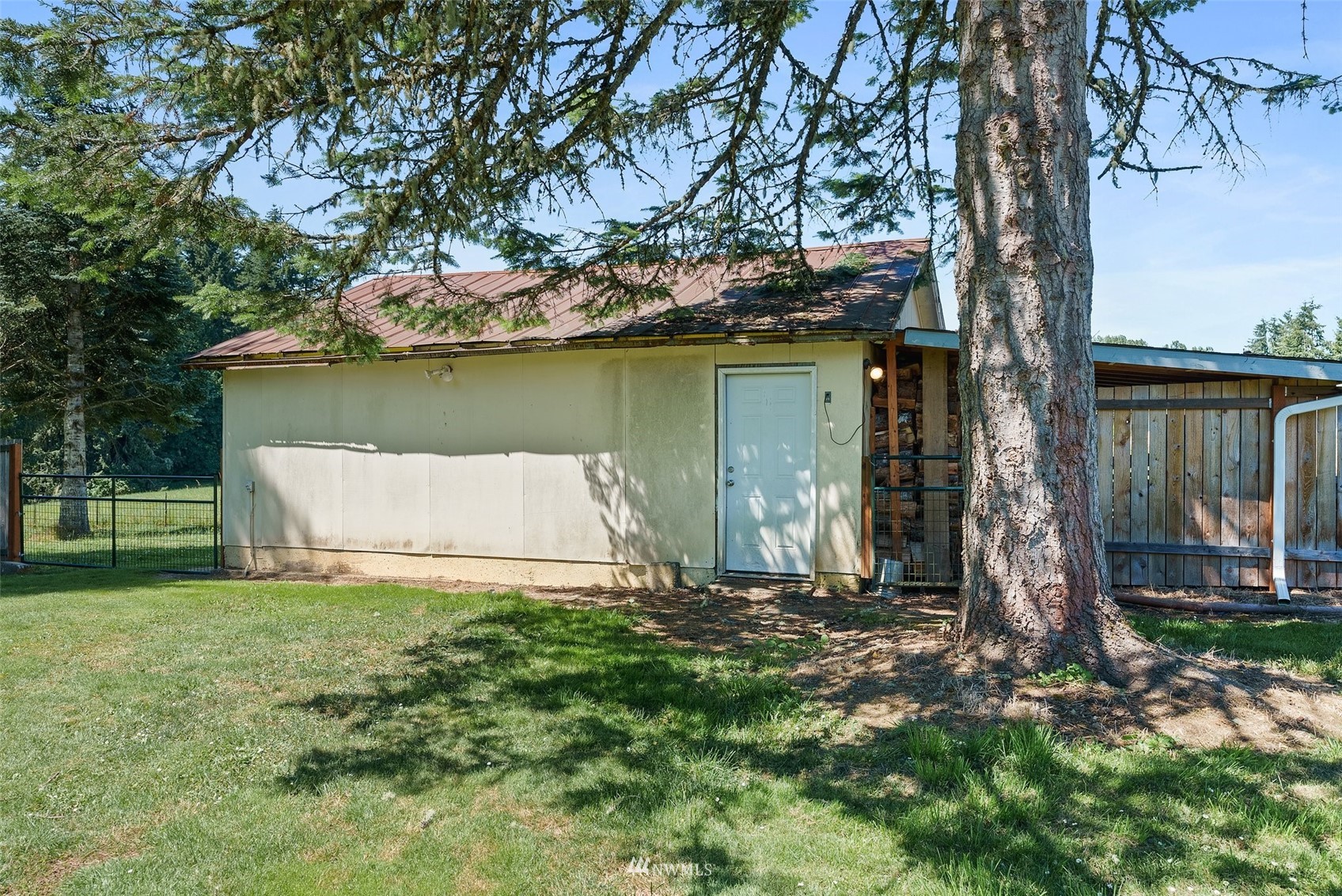 572 Rhoades Road Winlock, WA 98596 - Photo 29 of 35 a house with a tree in front of it