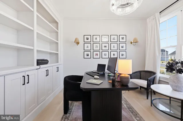 a work room with furniture and wooden floor